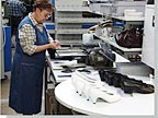 Inserting the insole adds the final component to the shoes.