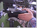 Heels are nailed and screwed to the insole hydraulically.